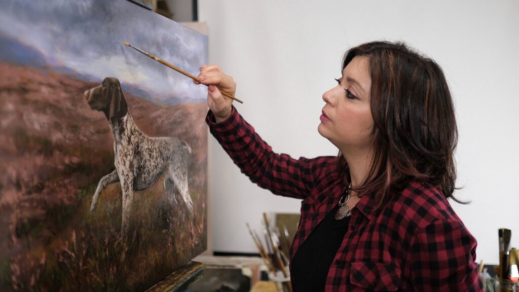 Maria Luisa Bevivino painting in her studio